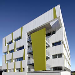 An office building with brilliant colours and a striped appe